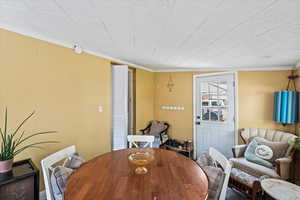 Dining area featuring crown molding