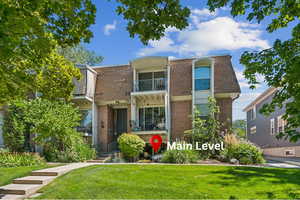 Front of property, Main-level, corner unit with walk-out patio.