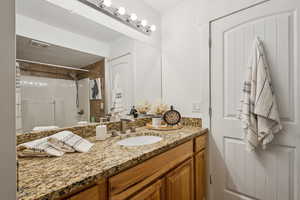 Full bathroom featuring vanity and shower / tub combination