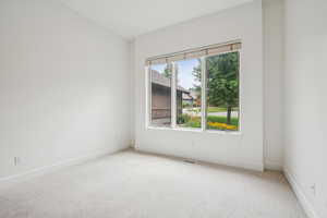 Unfurnished room featuring carpet flooring and baseboards