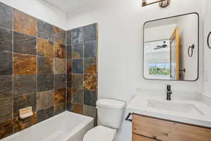 Bathroom with vanity and  shower combination