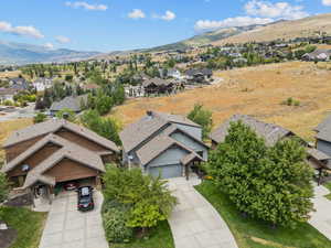 Aerial perspective of suburban area featuring a mountainous background