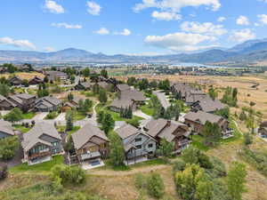 Aerial view of residential area featuring a mountain backdrop