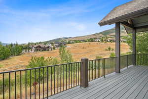 Wooden terrace featuring a mountain view