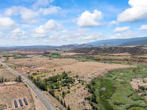 View of mountain backdrop with rural landscape