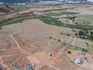 Aerial view of property and surrounding area with rural landscape and a mountain backdrop