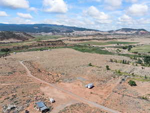 Aerial view of sparsely populated area with a mountain backdrop