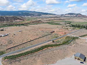 Overview of rural landscape with a mountain backdrop and a desert landscape