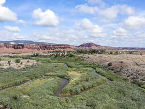View of mountain backdrop with rural landscape
