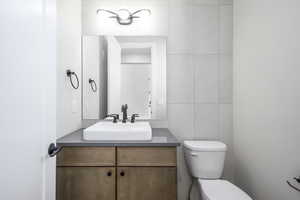 Half bath with vanity and toilet