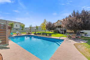 View of pool with a patio area