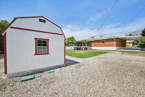 View of outdoor structure with an attached carport