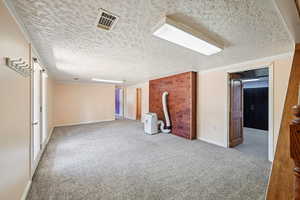 Family room  with carpet flooring and a textured ceiling