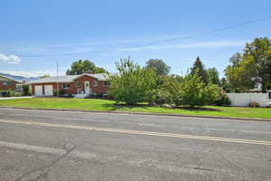 View of front of home featuring a garage and driveway