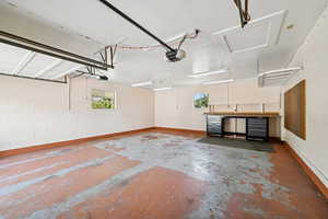 Garage with a garage door opener and concrete block wall