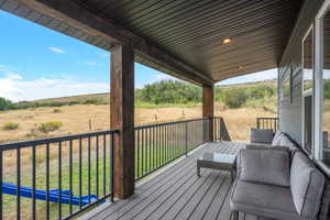 Deck featuring a lawn