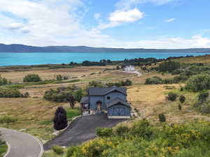View of subject property featuring a water and mountain view