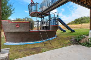 View of playground with a yard