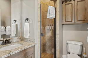 Full bath featuring vanity and a stall shower