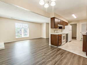 Open kitchen and living area with sliding door access to the private balcony, supporting functional layout and strong tenant appeal