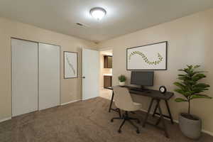 Home office with carpet and baseboards