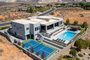 Drone / aerial view of a pool and a mountain backdrop