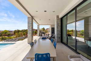 View of patio featuring outdoor dining area