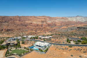 Bird's eye view of mountains and a pool area