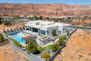 View of subject property with a pool area and mountains