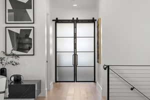 Bathroom featuring light wood-type flooring and baseboards