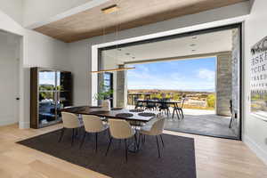 Dining space with light wood-type flooring and healthy amount of natural light