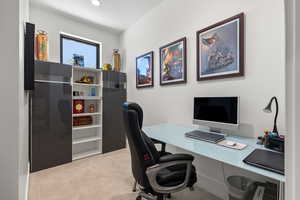 Office area featuring light colored carpet