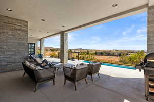 View of patio featuring a grill