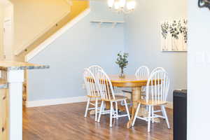 Dining room featuring a chandelier and wood finished floors