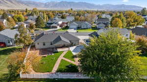 Aerial perspective of suburban area featuring a mountainous background