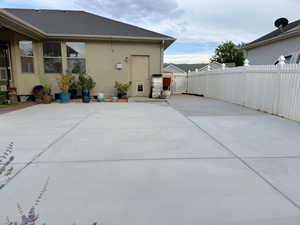 Back of house featuring a patio area and stucco siding