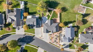 Aerial view of property and surrounding area with nearby suburban area