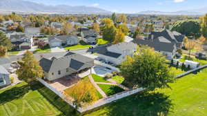 Aerial view of residential area featuring a mountainous background