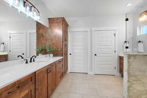 Bathroom featuring vanity and light tile patterned floors