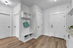 Mudroom with light wood-type flooring