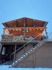 View of side of property with stairs