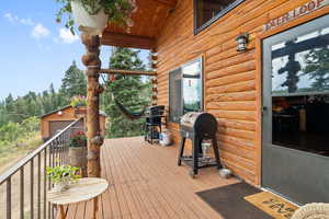 Deck with an outdoor structure and area for grilling