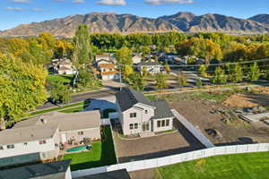 Aerial perspective of suburban area with a mountain backdrop