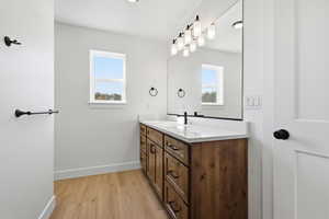Bathroom featuring vanity and light wood finished floors
