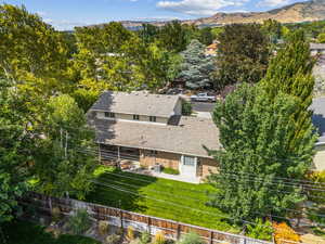 View of subject property featuring a mountainous background
