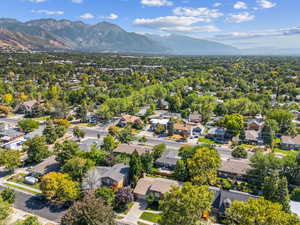 Aerial perspective of suburban area with a mountainous background