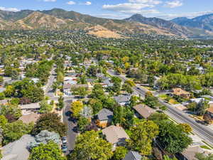 Aerial perspective of suburban area with a mountainous background