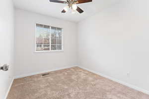 Unfurnished room with carpet and ceiling fan