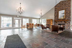 Common area with high vaulted ceiling