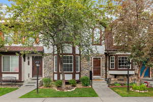 View of front of home with stone siding and stucco siding